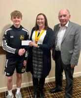 William Ellis is presented with a sponsorship cheque from President Elect Carole Owczarek and Rotarian David Hastings.